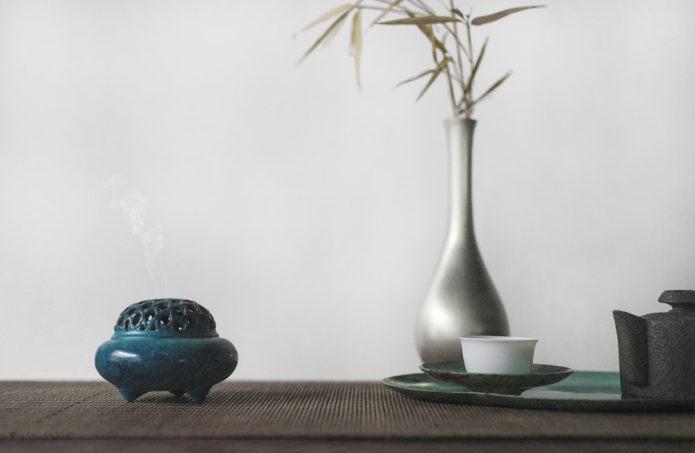 brown plant in vase on table