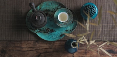 flat lay photography of teapot on tray traditional teams background