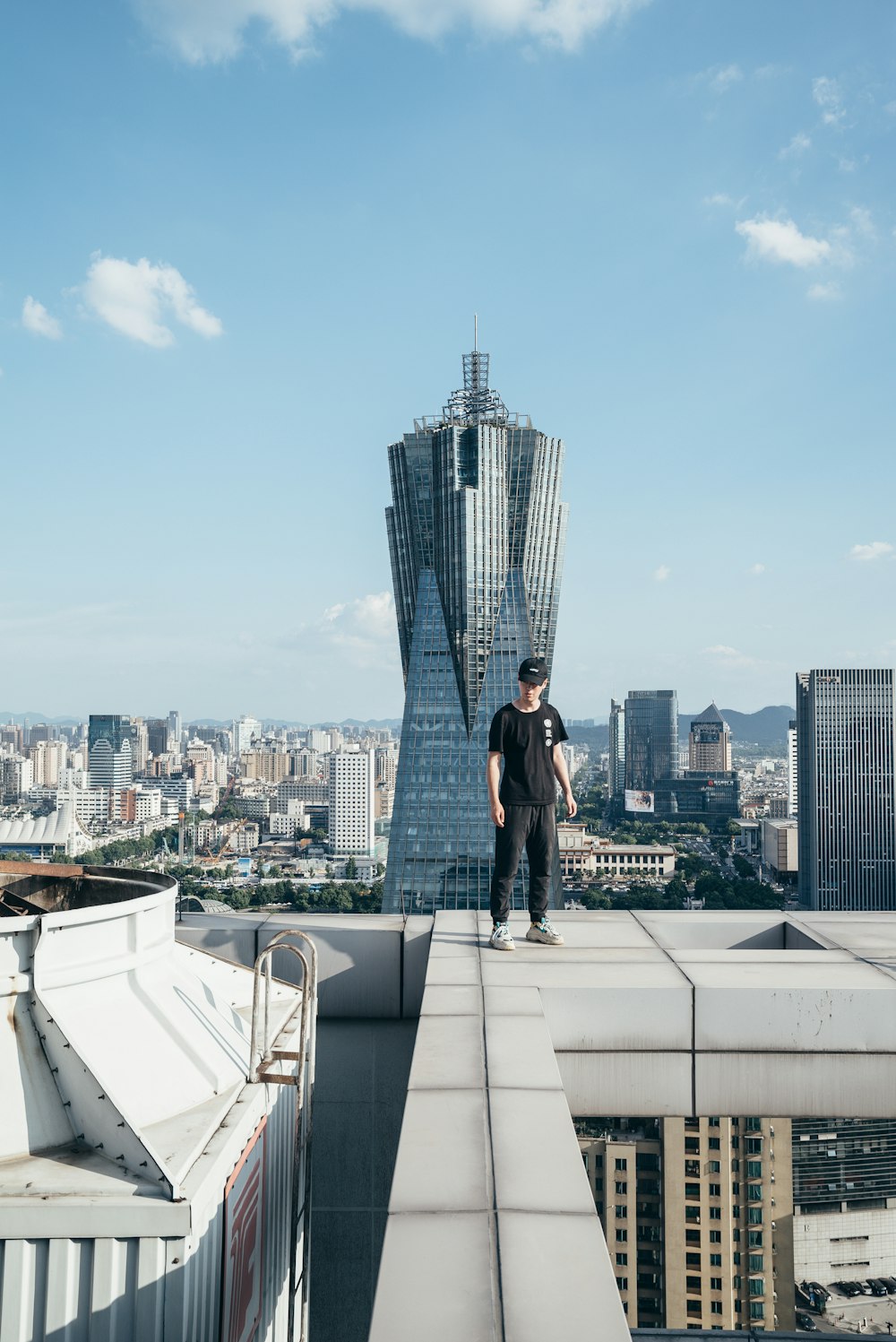 man standing on top of a building
