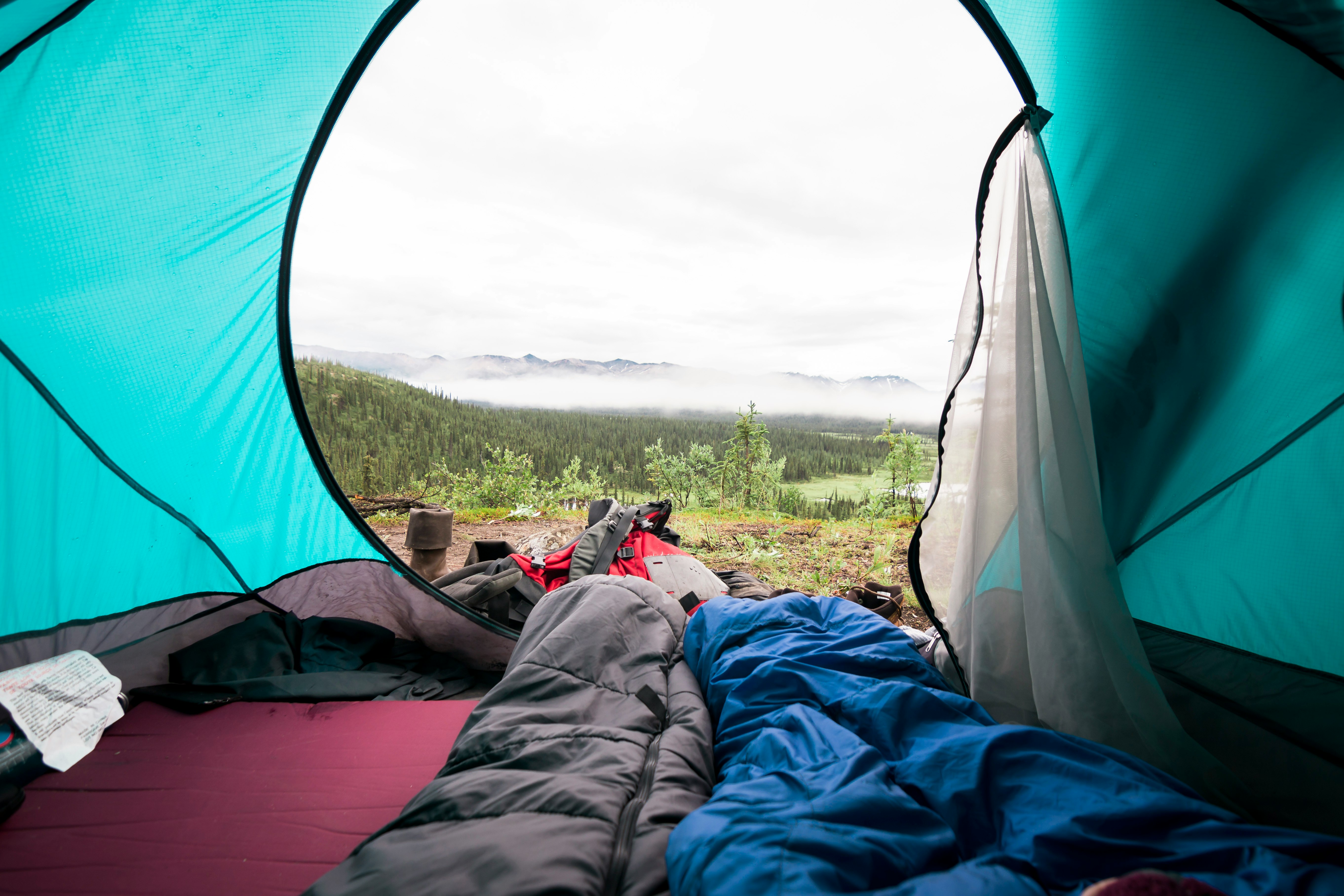 blue and gray sleeping mat inside tent