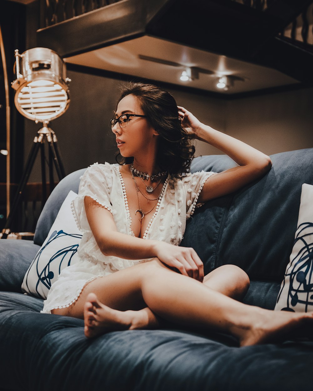 woman sitting on blue suede couch