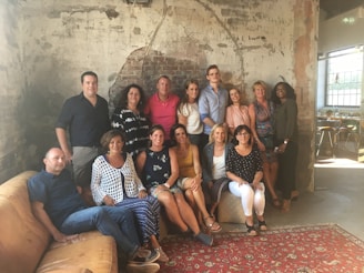 Group photo of the Castelo Live team celebrating a successful live event in a cozy studio environment