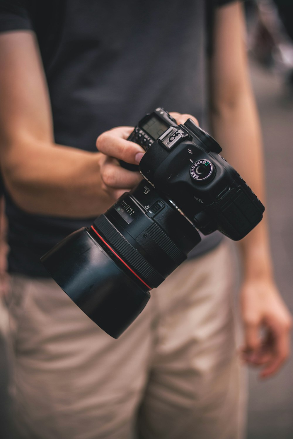 person holding DLSR camera