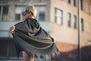 selective focus photography of boy wearing black Batman cape