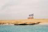 Paradise signage on seashore