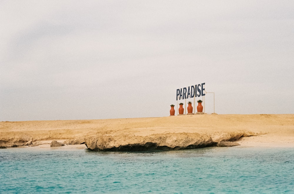 Paradise signage on seashore
