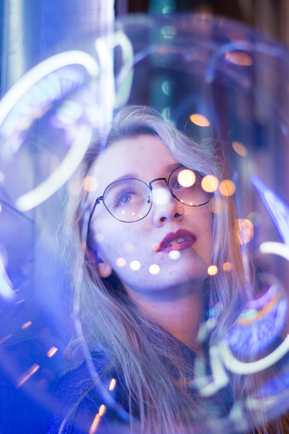 selective focus photography of woman wearing eyeglasses