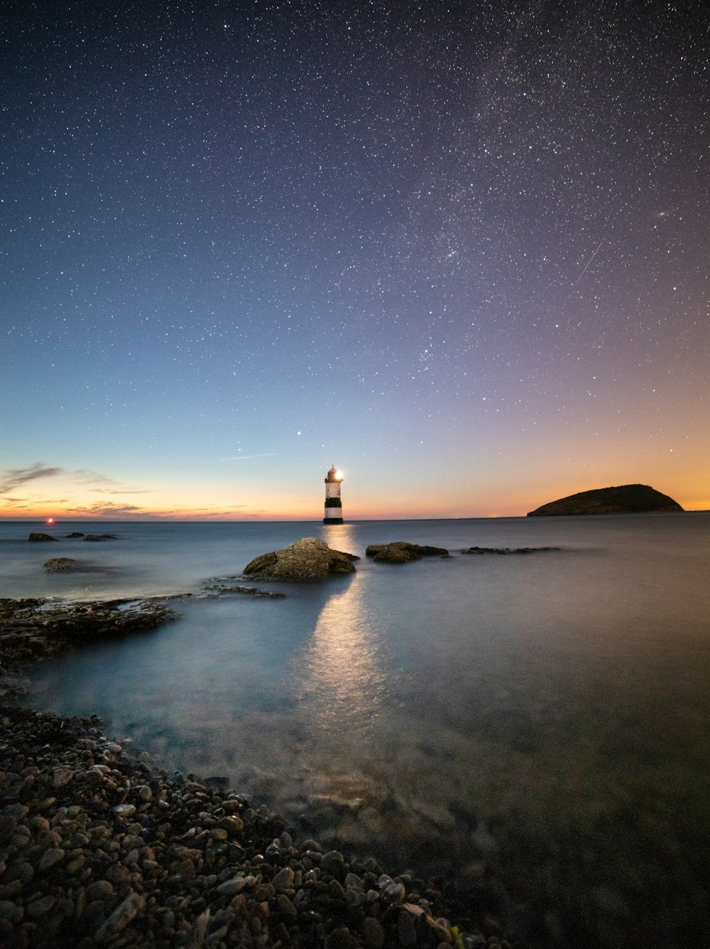 turned on black and white lighthouse