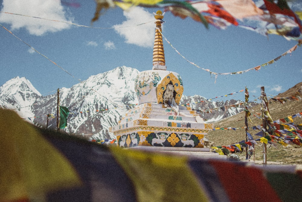 yellow and white tower near mountain