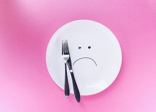 silver fork and knife on plate