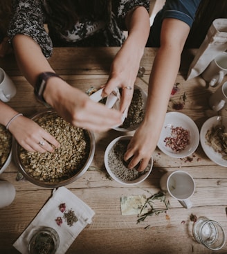 people mixing items on bowl