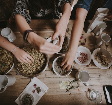 people mixing items on bowl