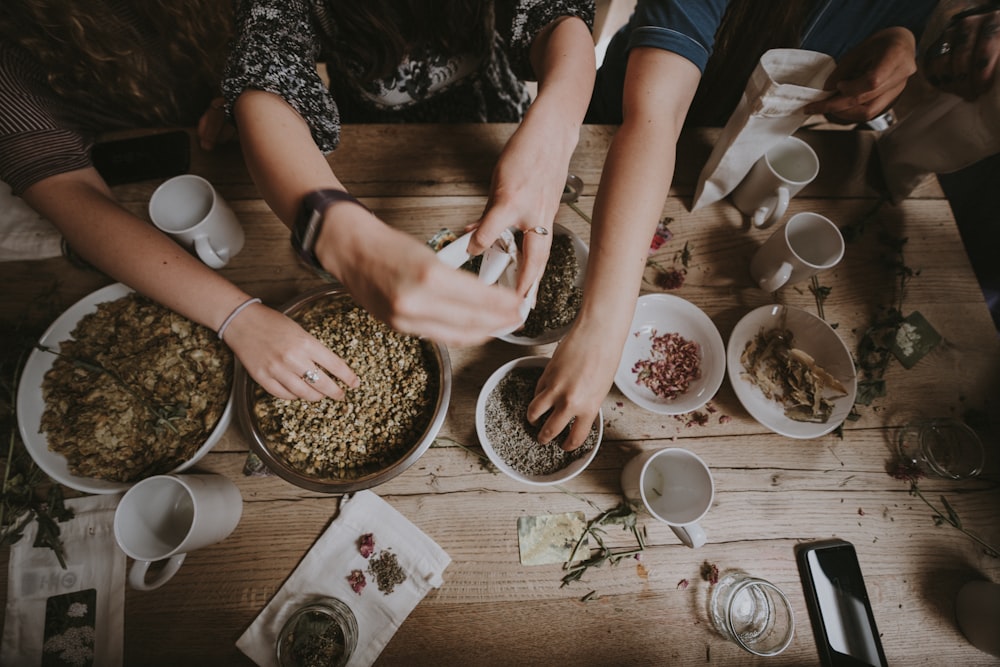 people mixing items on bowl