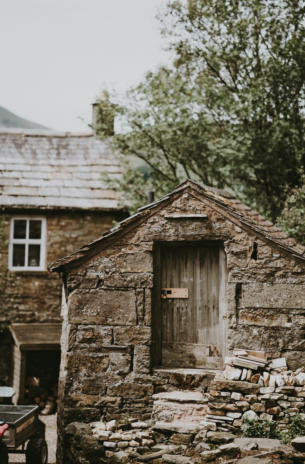 selective focus photography of beige brick shed