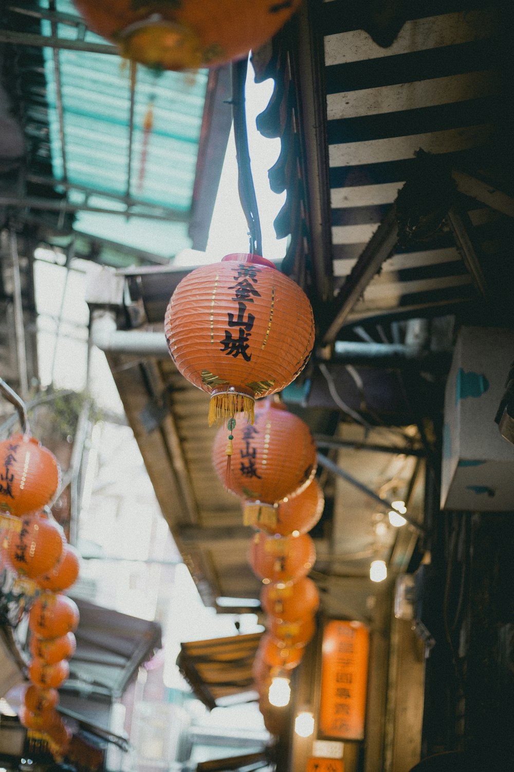 red paper lantern hanging outside the houses