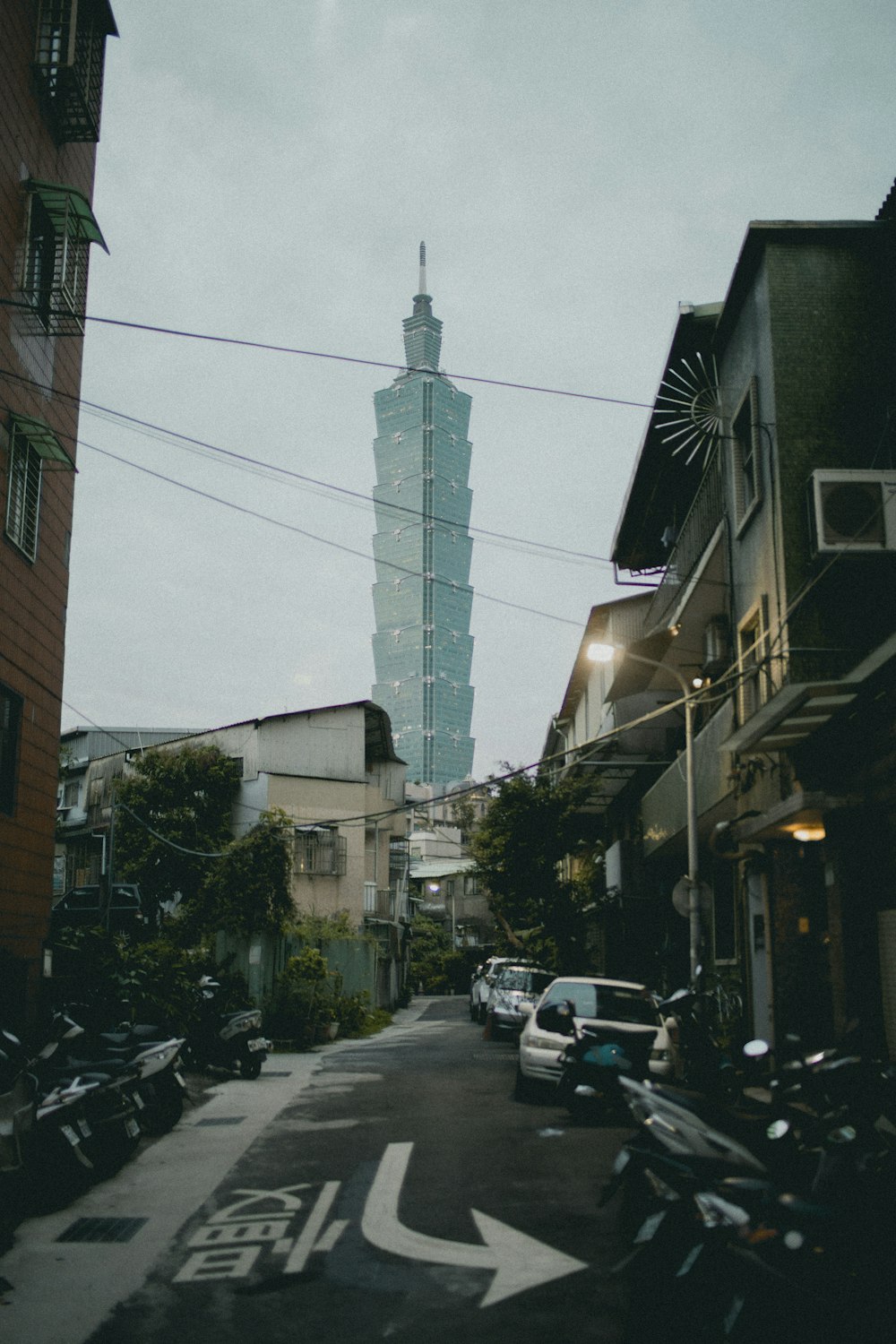 alleyway with view of high building