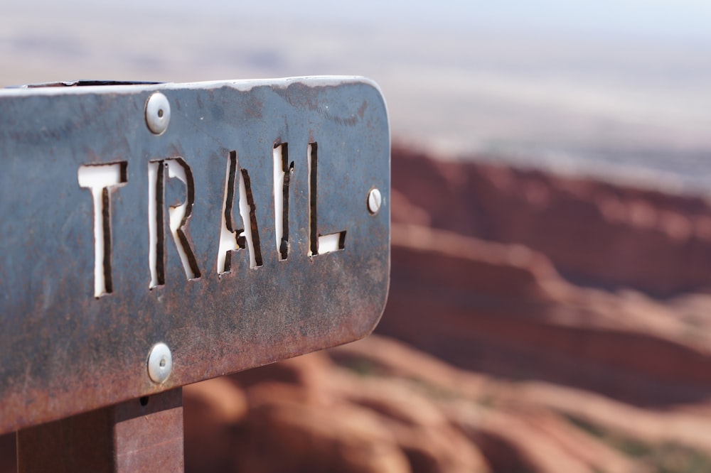 trail signage selective focus photography