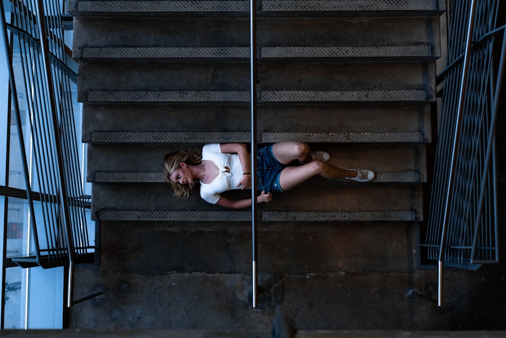 woman lying on stairs