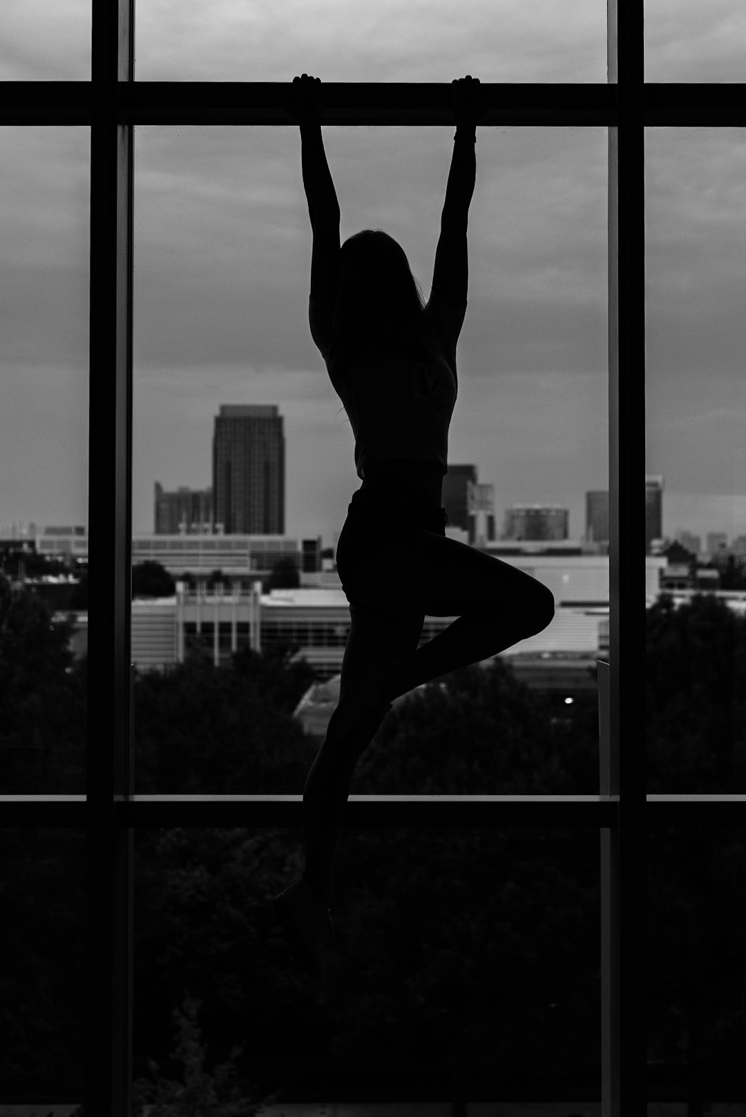 girl hanging on steel beam