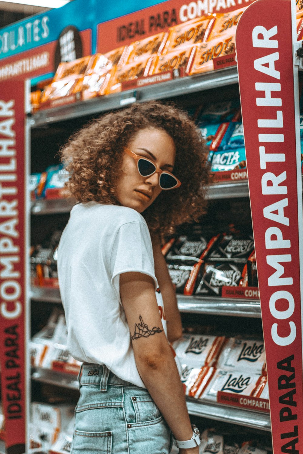 woman standing in front of shelf