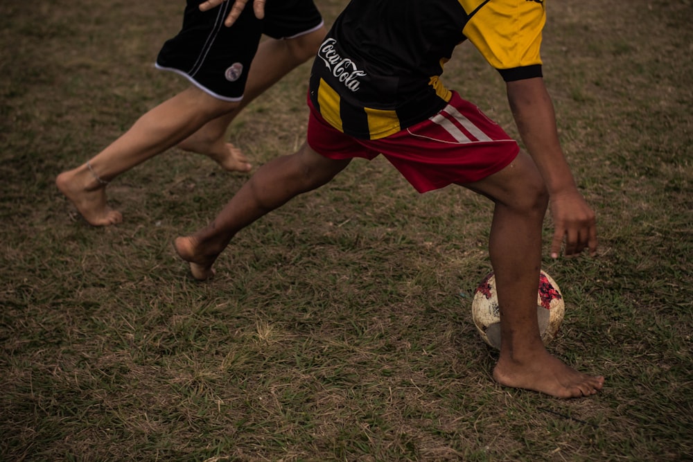 two men playing soccer balls