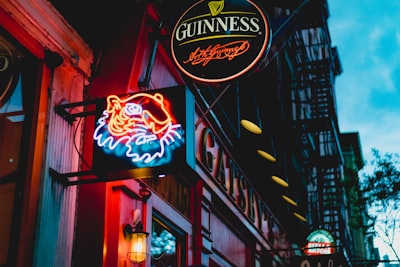 scenery of a guinnes led signage irish teams background