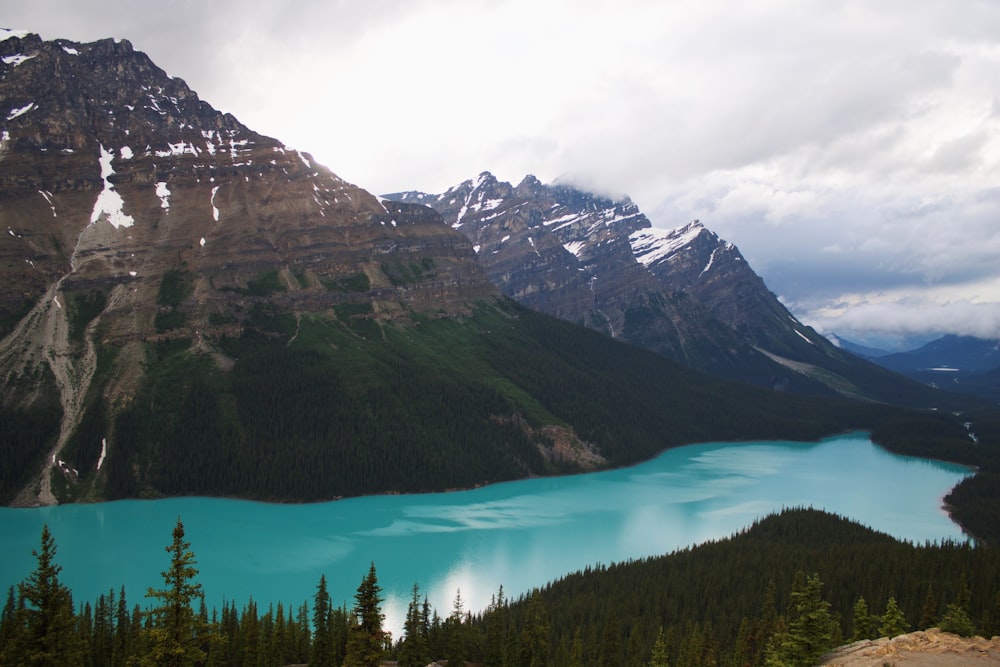 mountain range with blue calm body of water