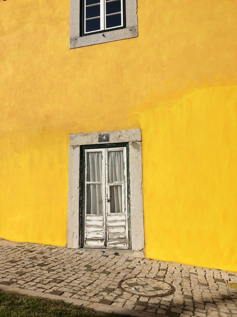 white door on yellow wall