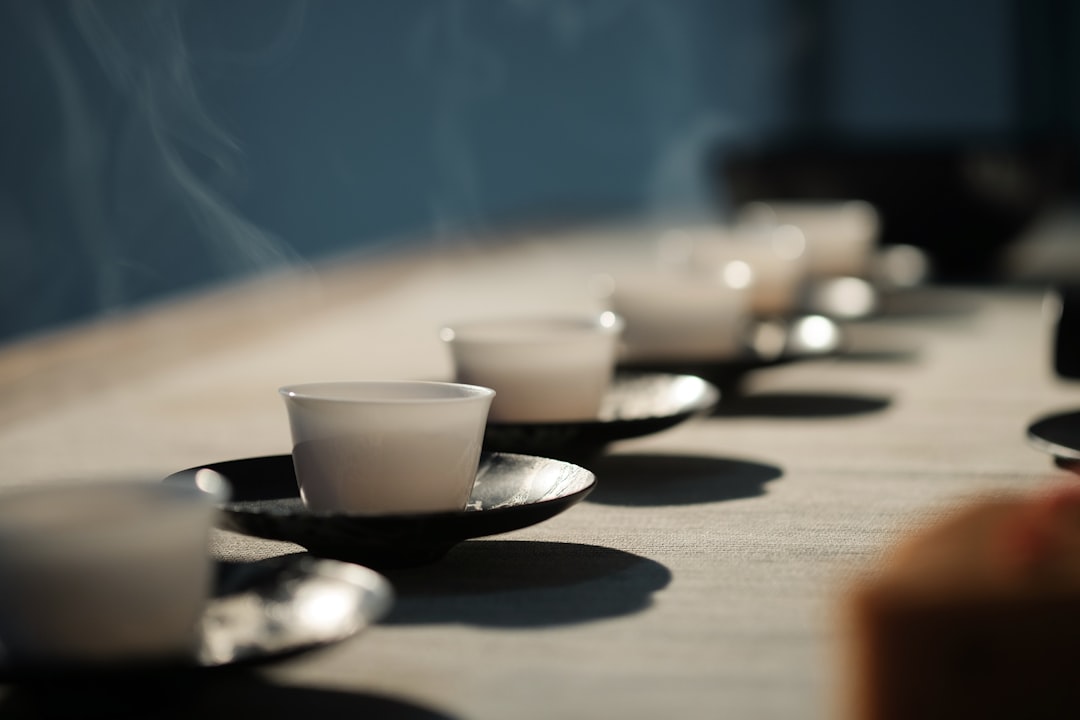 white disposable cups on black saucers, Tea ceremony