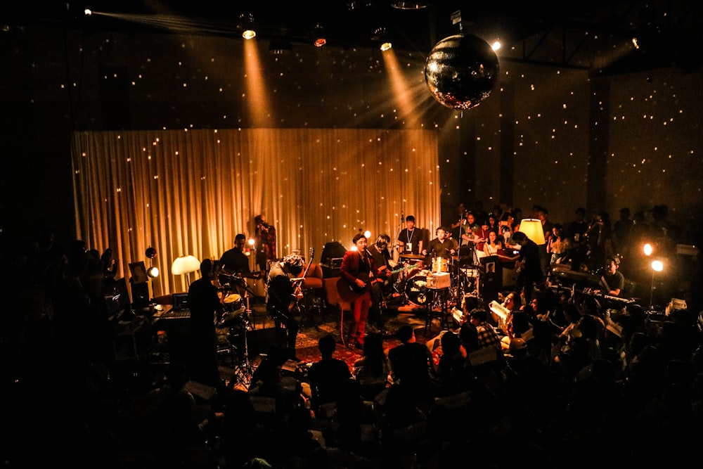 band inside room with disco ball