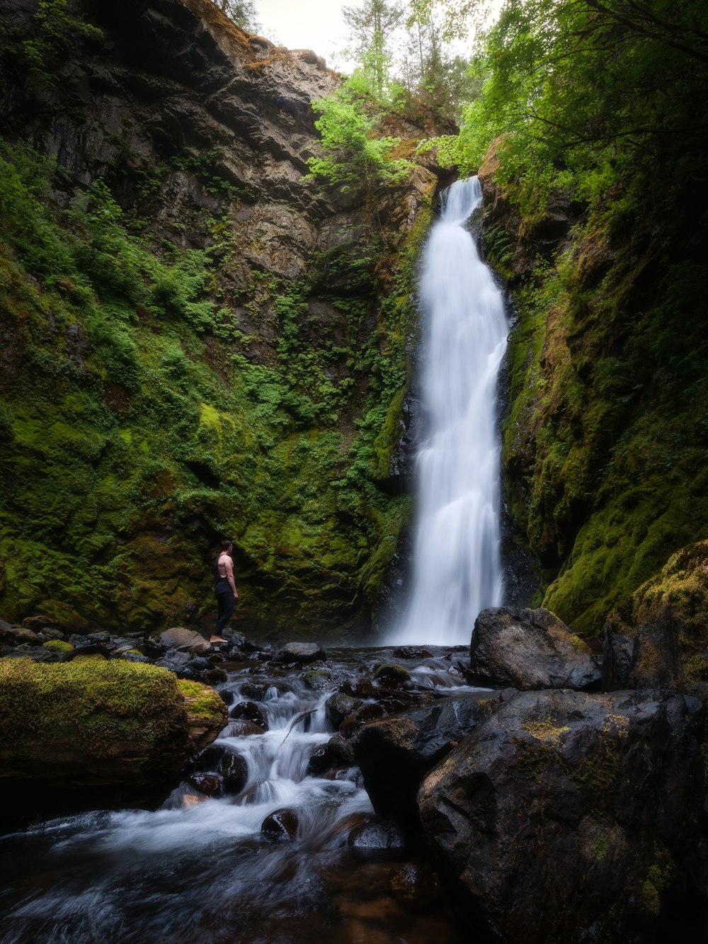 waterfalls in the middle of rocks