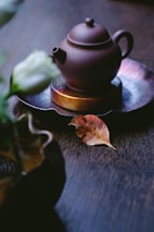brown kettle on saucer