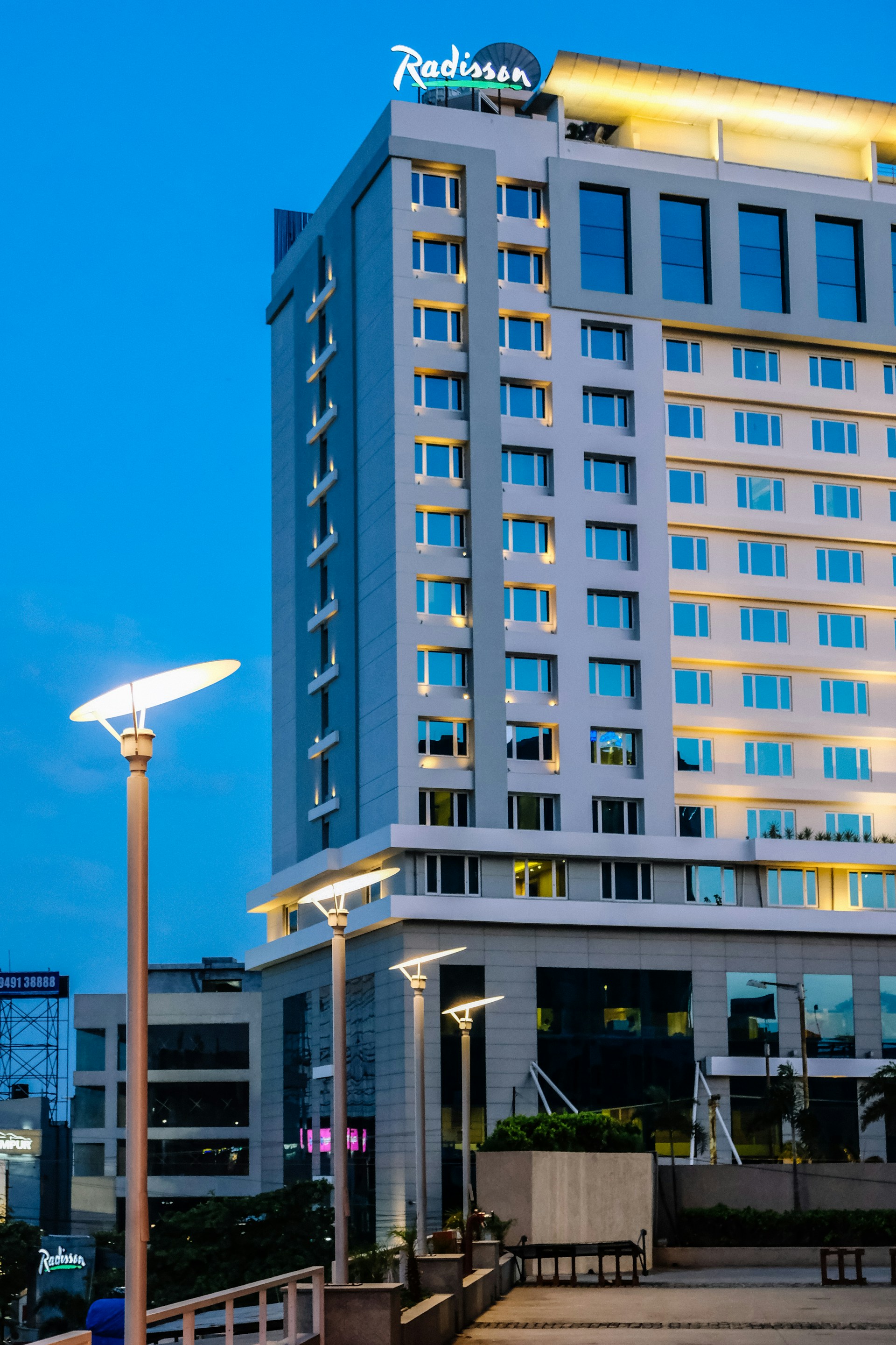 woman wearing yellow long-sleeved dress under white clouds and blue sky during daytime