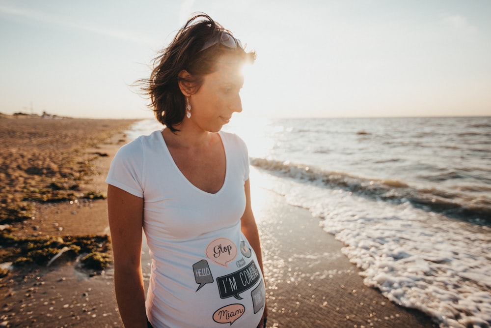 woman standing near shoreline