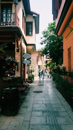 people walking in between high-rise buildings at daytime