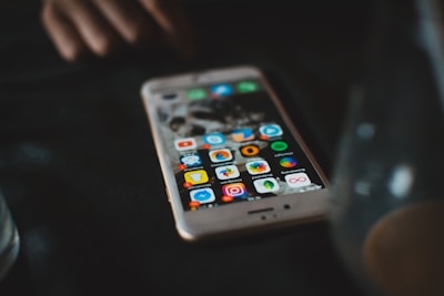 selective focus photography of turned-on gold iPhone 6s