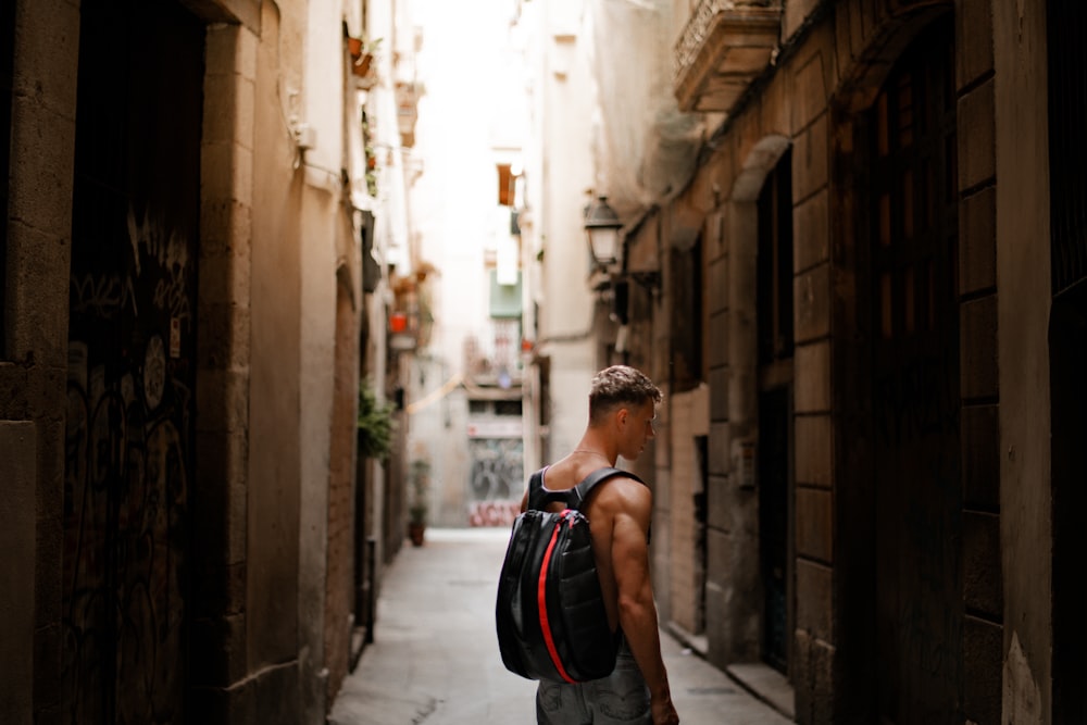 man standing near concrete building