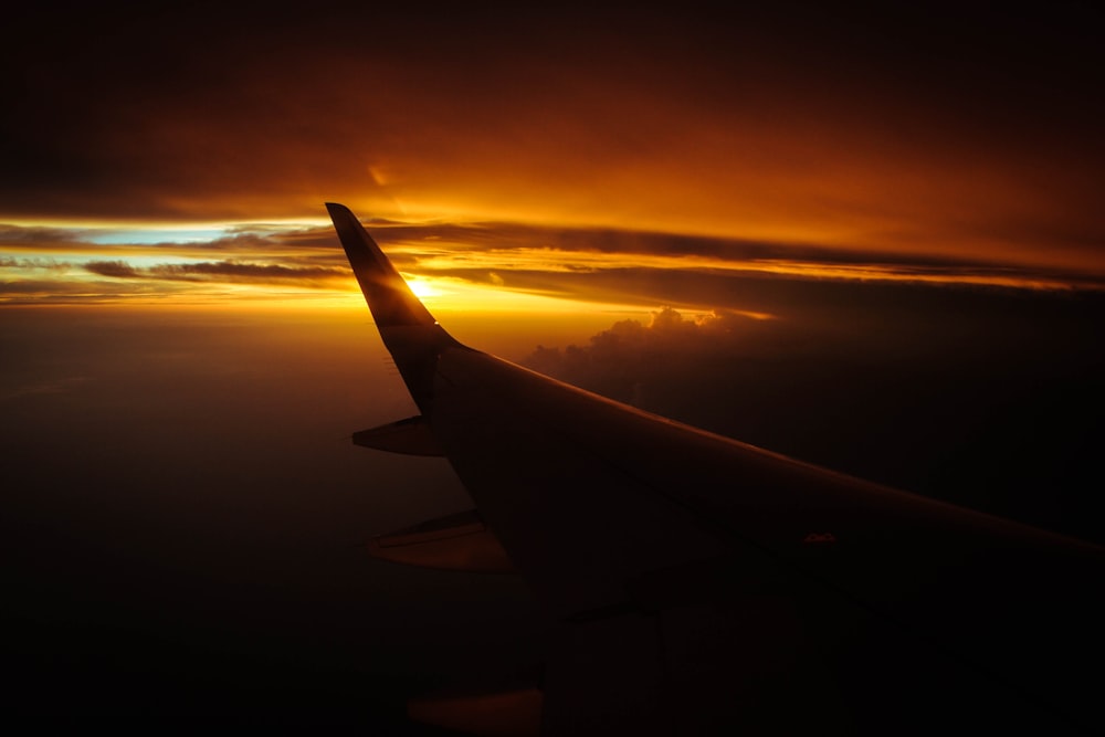 plane's wing during golden hour
