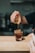 person pouring coffee on rock glass