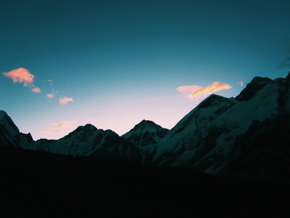 mountain range covered by white snow