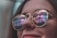 woman wearing sunglasses while smiling