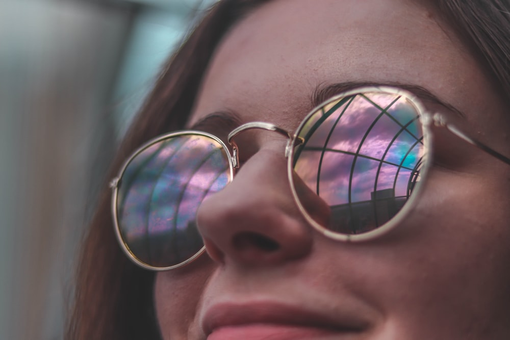 woman wearing sunglasses while smiling