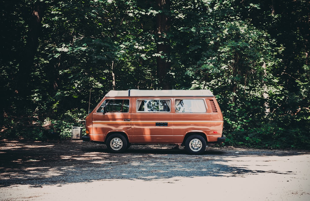 orange van parked near tree