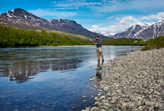 man fishing on the river