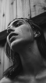 grayscale photo of wet woman