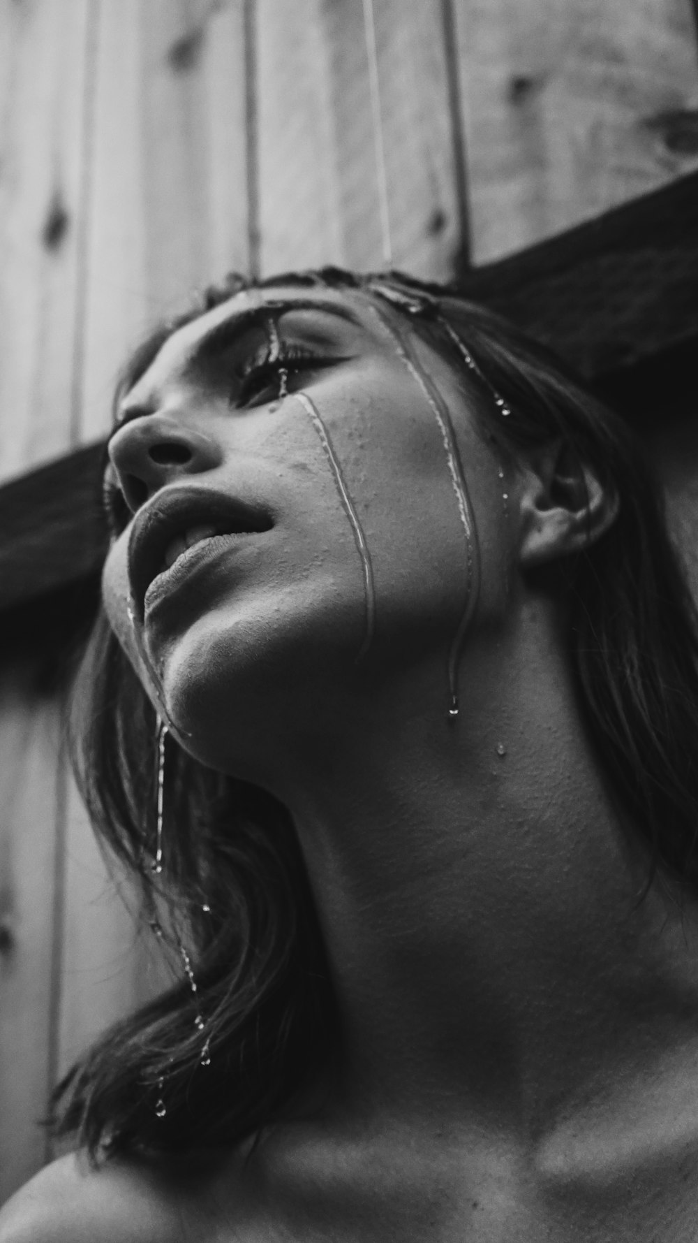 grayscale photo of wet woman