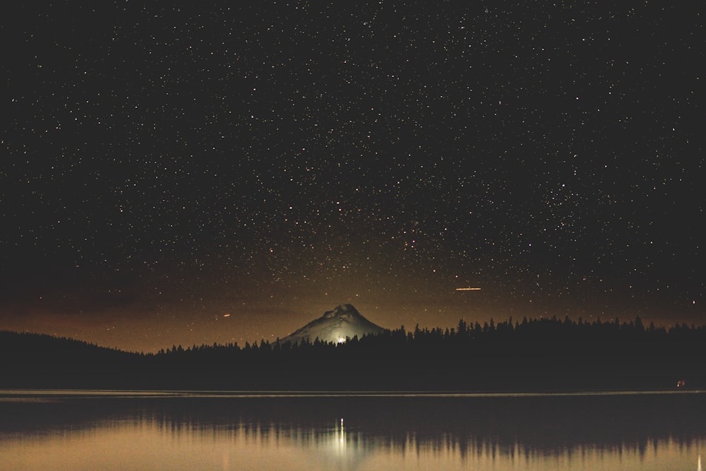 body of water near mountain