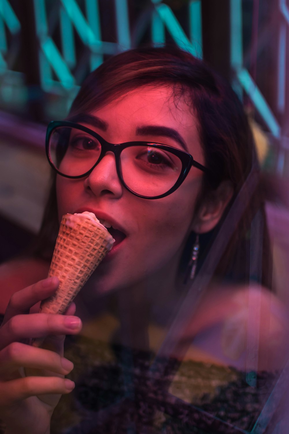 woman eating ice cream holding cone