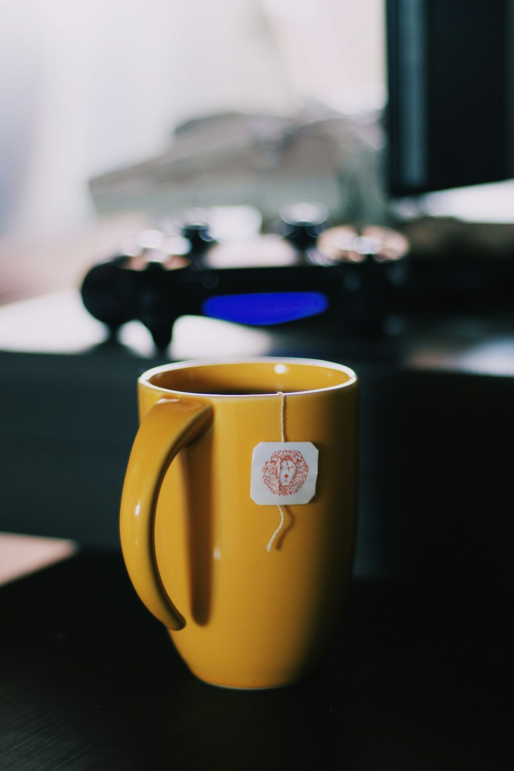 selective focus photography of ceramic mug