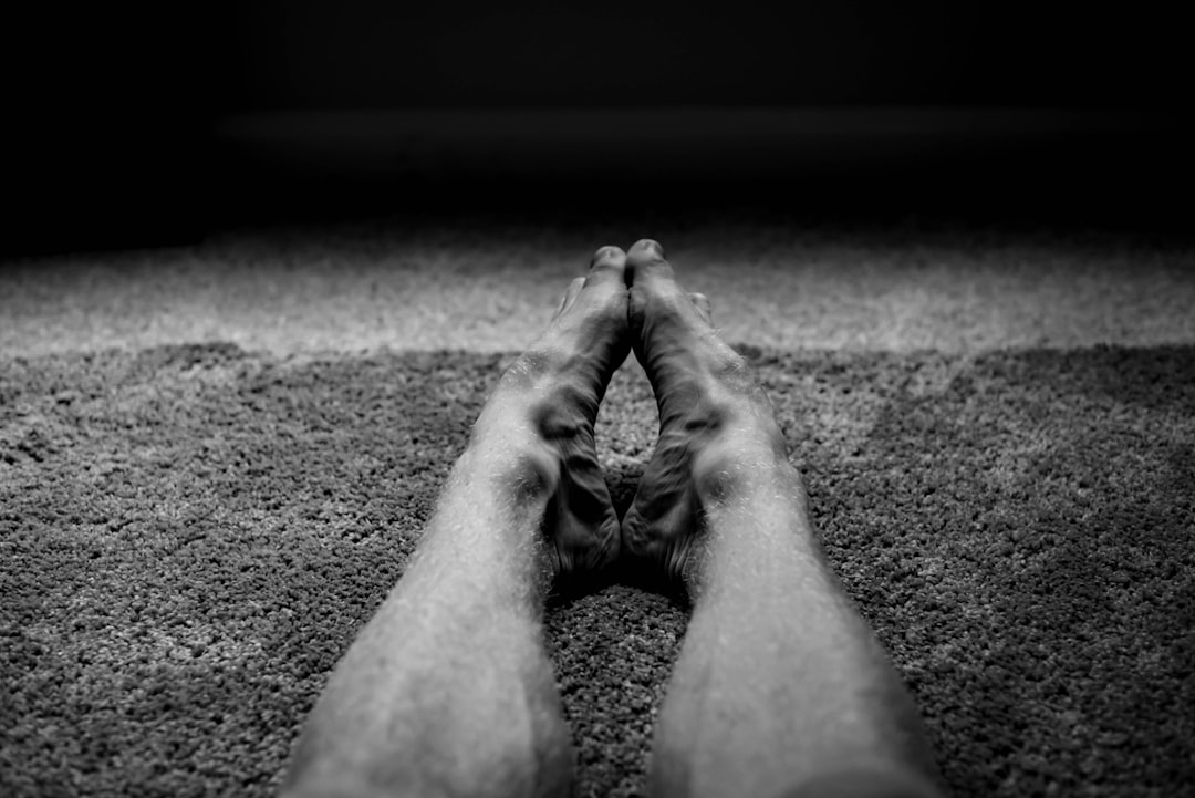grayscale photo of human feet